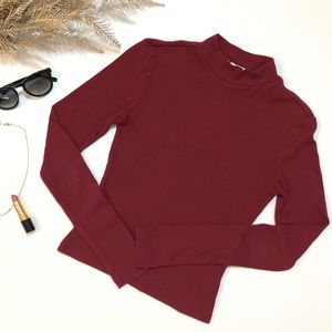 Red turtleneck long-sleeve shirt